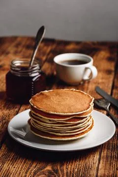 Stack of pancakes on white plate 스톡 사진
