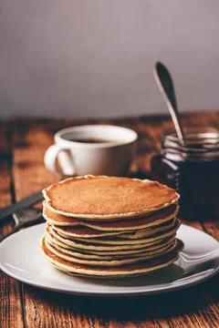 Stack of pancakes on white plate Stock Photos