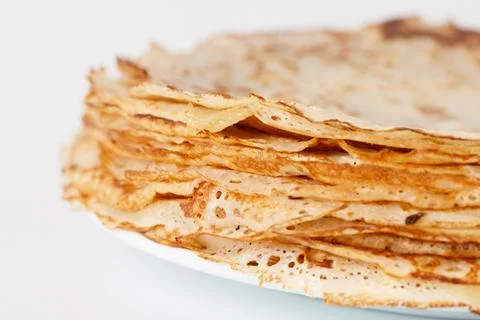 A stack of pancakes on a white plate Stock Photos