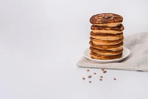 A stack of pancakes on a white plate. on a white background. empty space Stock Photos