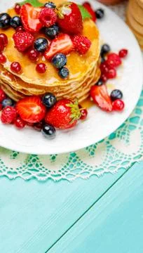 Stack of pancakes on wooden background Stock Photos