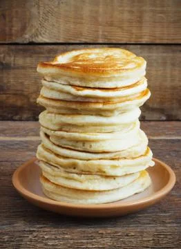 Stack of pancakes on a wooden background Stock Photos