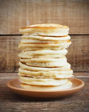 Stack of pancakes on a wooden background Stock Photos