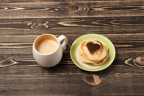 Stack of pancakes on wooden board Stock Photos
