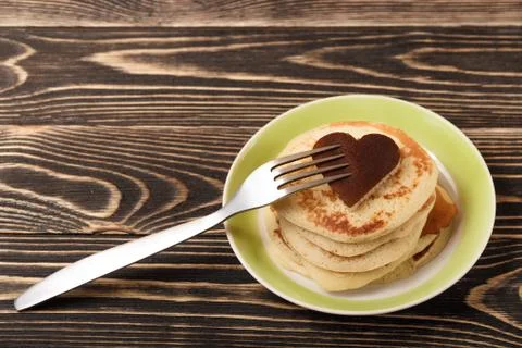 Stack of pancakes on wooden board Stock Photos