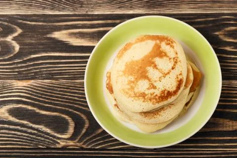 Stack of pancakes on wooden board Stock Photos