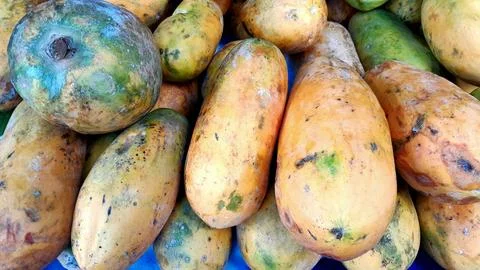 A stack of papayas at the traditional marke Stock Photos