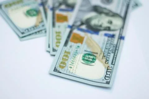 Stack of paper 100 dollars USA on the white background Stock Photos