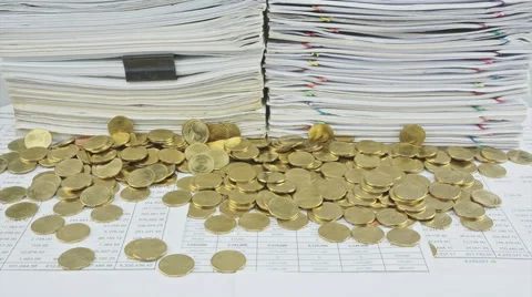 Stack paper and gold coins on table time lapse Stock Footage 50278801