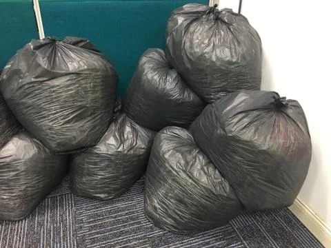 Stack the paper on a black plastic wrap. Stock Photos