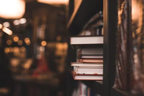 Stack of paper books in bookstore or library close up. Back to school concept Stock-Fotos