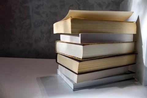 Stack of paper books for education reading study and library concept Stock Photos