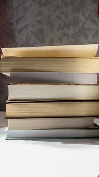 Stack of paper books for education reading study and library concept Stock Photos