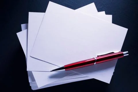 Stack of paper cards and pen Stock Photos
