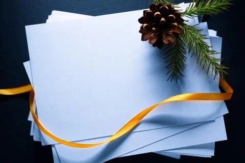 Stack of paper cards and twig of evergreen fir 写真素材