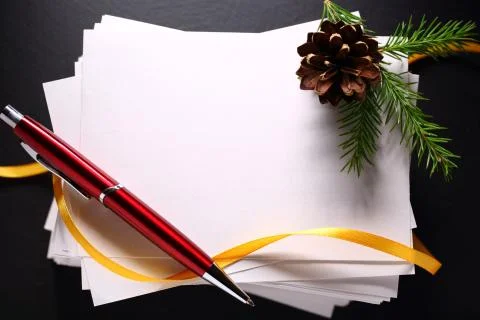Stack of paper cards and twig of evergreen fir Foto stock