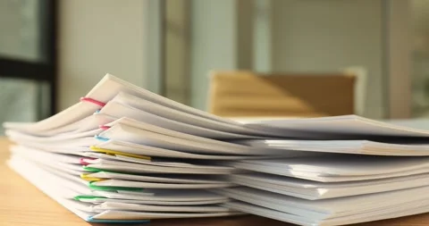 A stack of paper with colored paper clips, close-up Stock Footage 257552789