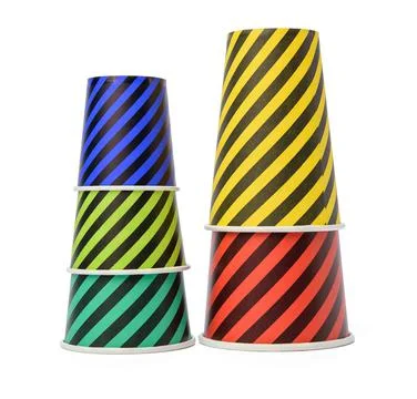 Stack of paper disposable striped cups isolated on white background Stock Photos