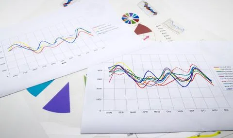 Stack of paper documents with financial reports and statistic information dat Stock Photos