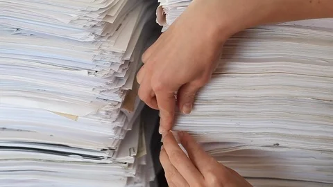 Stack of paper documents with a hand. Stock Footage 118449721