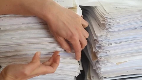 Stack of paper documents with a hand. Video stock 118450524