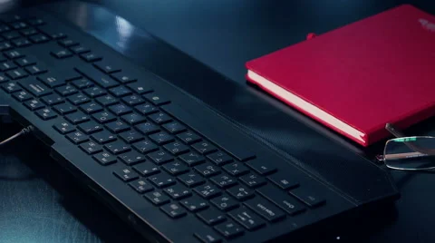 Stack paper falling on keyboard Stock Footage 58234702