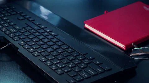 Stack paper falling on keyboard Stock Footage 58234751