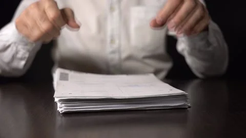 A Stack Of Paper Files Falls On The Table. Fists Hit the Pile of Papers Stock Footage 146642440