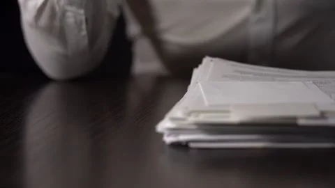 A Stack Of Paper Files Falls On The Table. Fists Hit the Pile of Papers Stock Footage 167885776