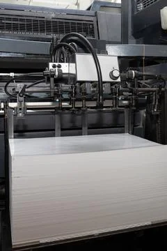 A stack of paper is loaded into a typewriter Foto stock