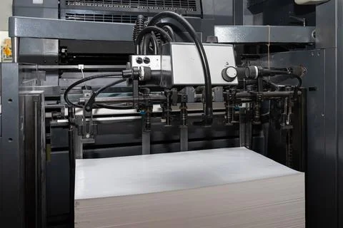 A stack of paper is loaded into a typewriter Stock Photos