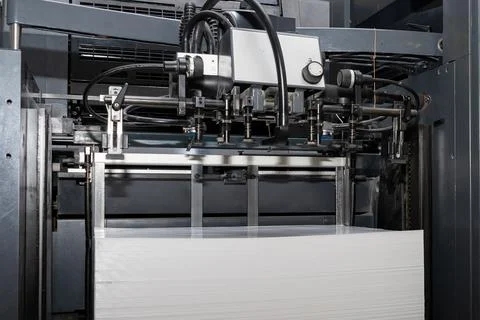 A stack of paper is loaded into a typewriter Foto stock