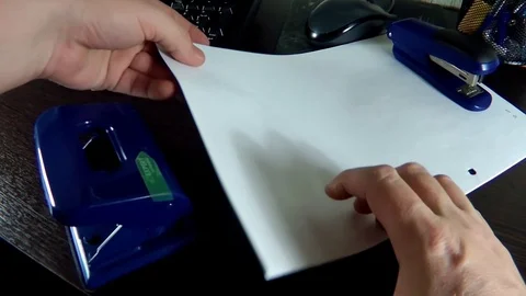 In the stack of paper to make holes Stock Footage 70612864