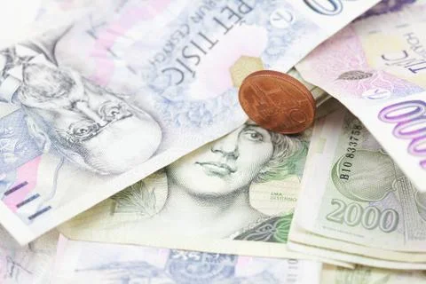 Stack of paper money and coins Stock Photos