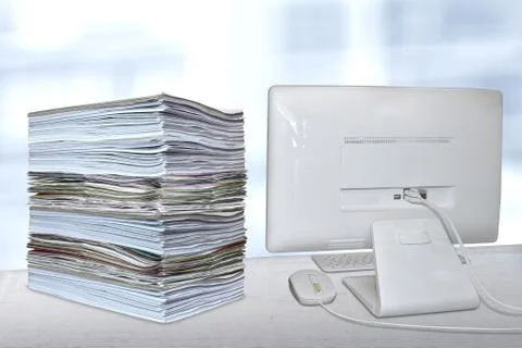 Stack of paper pile file office desk pc computer Stock Photos