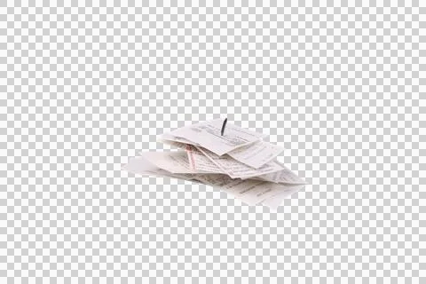 A stack of paper receipts is pierced by a single pushpin Stock Photos