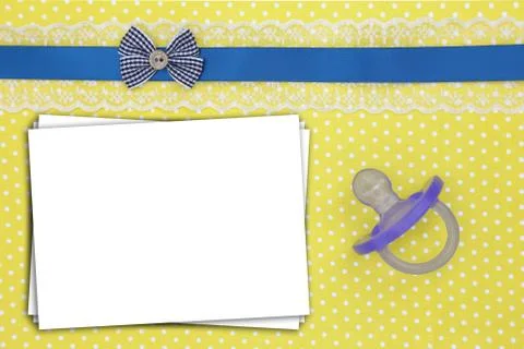 Stack of paper sheets and blue pacifier on polka dots background Stock Photos