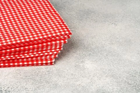 Stack of paper square napkins on gray background Foto stock