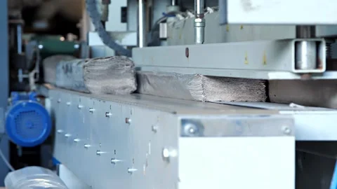 Stack of paper towels on a cutting and packaging conveyor. Stock Footage 244744567