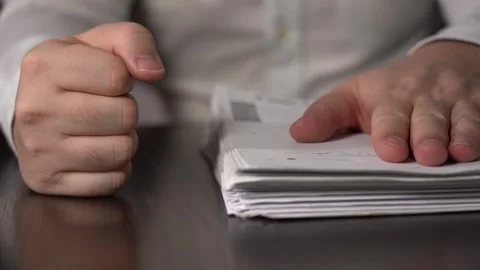 Stack of Papers and Fist Men. Businessman Gets Stress and Nervous Breakdown at Stock Footage 146454303