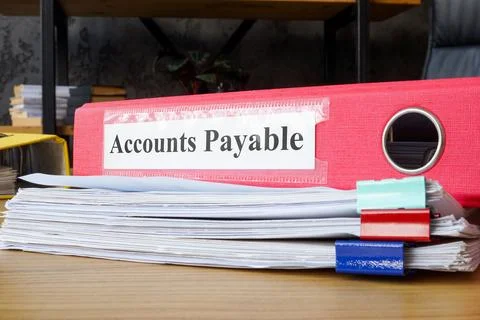 Stack of papers and folder accounts payable. Financial management and account Stock Photos