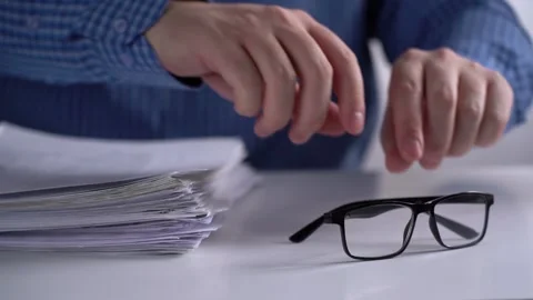 Stack of Papers and Glasses on the Background of the Manager. Video stock 150444577