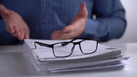 Stack of Papers and Glasses on the Background of the Manager. Stock Footage 151463877