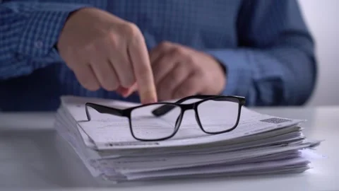 Stack of Papers and Glasses on the Background of the Manager. Stock Footage 166996625