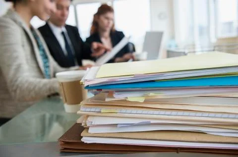 Stack of papers on desk in office Foto stock