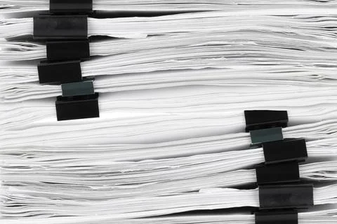 Stack of papers with paper clips, office folders. Background, texture. Stockfoto's