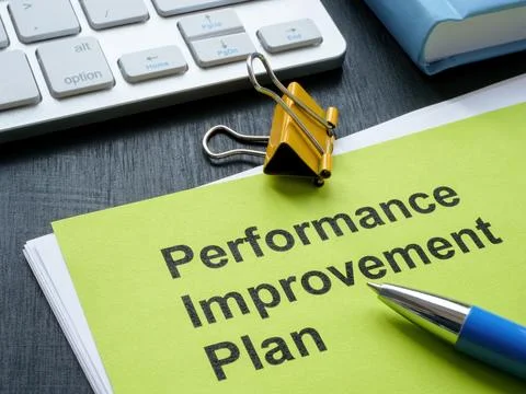 Stack of papers with Performance Improvement Plan PIP. Stock Photos