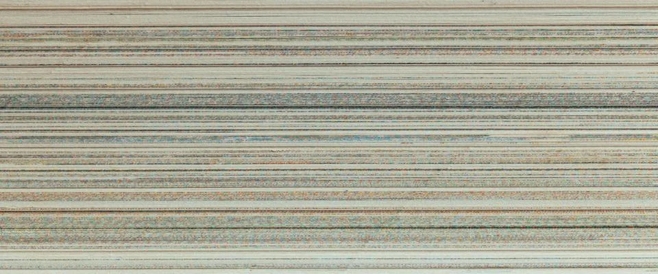 Stack of papers reveals lines, hints of printed text, and subtle texture Stock Photos