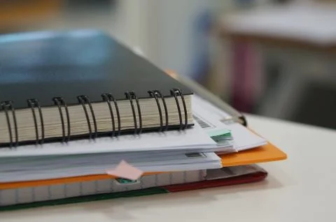 Stack of paperwork and black notebook Stock Photos
