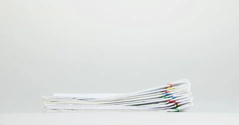 Stack paperwork overload on white table time lapse Stock Footage 60598989